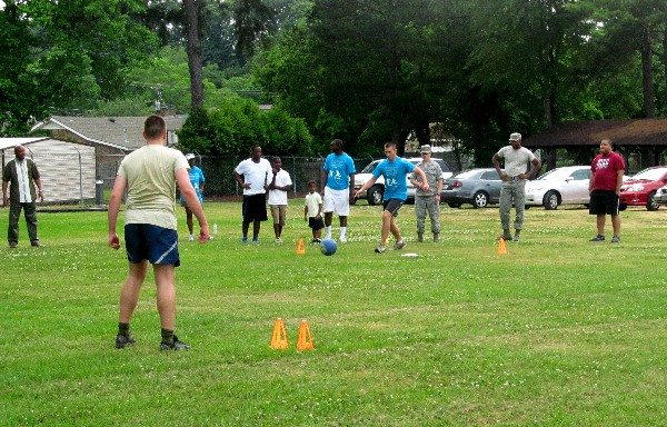 In May, Young AFCEANs take the field for kickball during a networking activity day.
